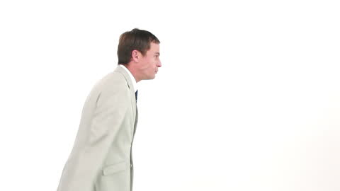 Businessman Shouting through Megaphone in White Background