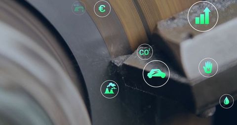 Rotating metal cylinder with augmented reality icons in factory