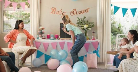 Joyful Baby Shower Party with Excited Friends in Bright Living Room