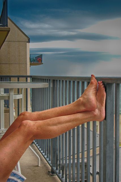 Relaxed Legs on Balcony with Ocean View at Sunset - Download Free Stock Images Pikwizard.com