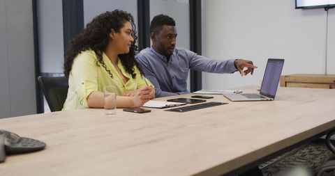 Colleagues Discussing Project on Laptop in Office Meeting Room - Download Free Stock Images Pikwizard.com