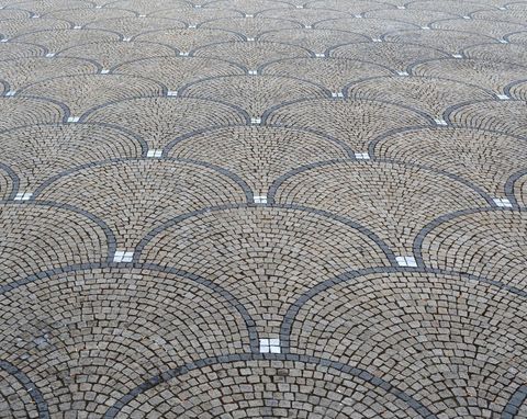Intricate cobblestone patterned pavement