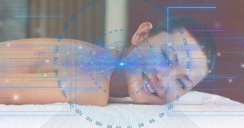 Woman relaxing on spa table with futuristic holographic wellness interface