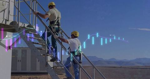 Technicians climbing metal stairs with data overlay on desert construction site