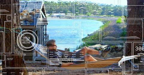Man relaxing in hammock overlaid with futuristic hud