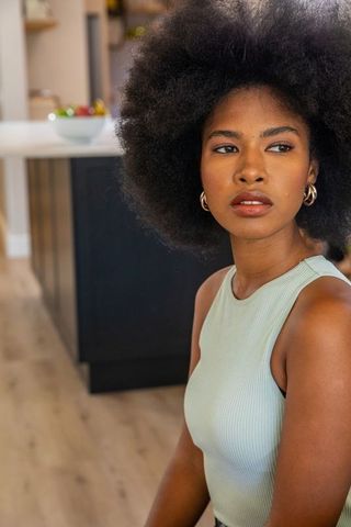 Elegant African American Woman in Contemporary Kitchen with Modern Design