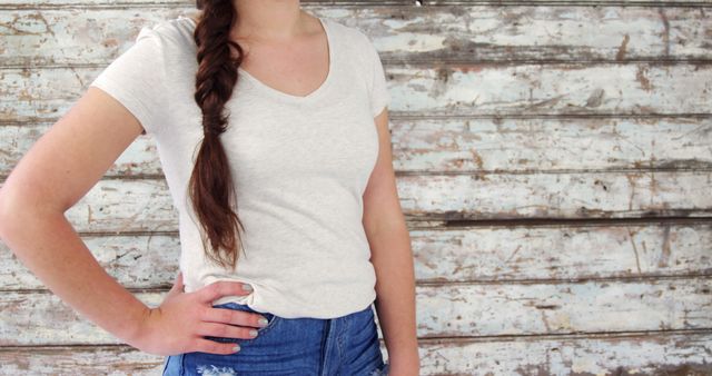 Casual Young Woman with Long Brown Braid in Rustic Background - Download Free Stock Images Pikwizard.com