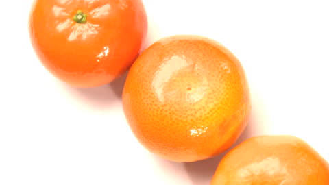 Vibrant Fresh Oranges on White Background