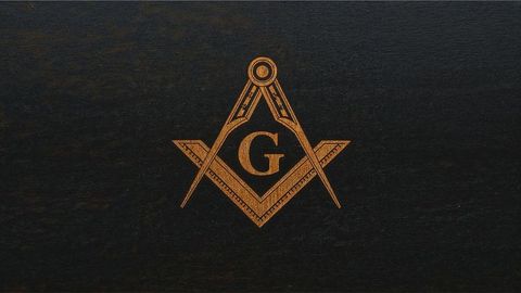 Masonic luxurious freemasonry emblem on dark wood background