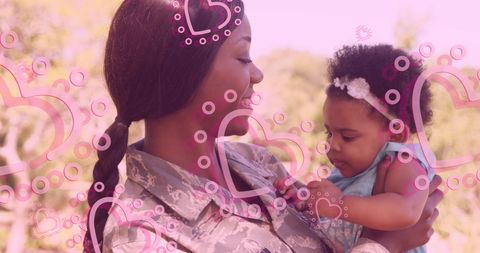African American Military Mother Embracing Daughter with Love