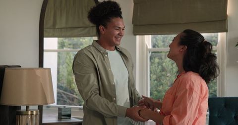 Joyful couple embracing new parenthood at home