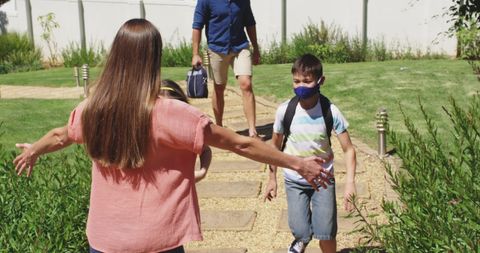 Children Embracing Mother After School Homecoming - Download Free Stock Images Pikwizard.com