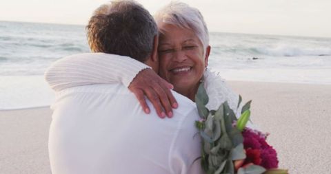 Senior Couple Embracing on Beach Celebrating Engagement - Download Free Stock Images Pikwizard.com