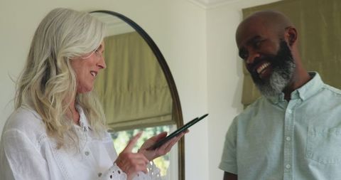 Senior couple bonding over wedding plans at home