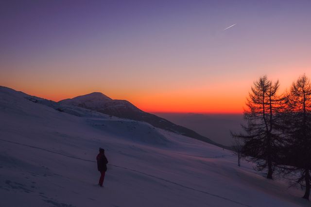 Serene Winter Mountain Landscape at Sunset with Silhouetted Figures - Download Free Stock Photos Pikwizard.com