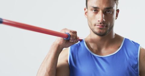 Focused javelin athlete demonstrating strength and determination