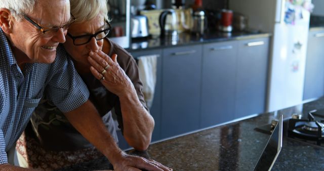 Elderly Couple Enjoying Video Call in Modern Kitchen - Download Free Stock Images Pikwizard.com