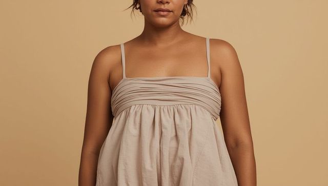 Elegant woman in ruched spaghetti-strap dress