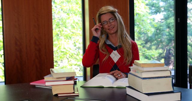 Female Student Studying with Books in Library During Daytime - Download Free Stock Images Pikwizard.com