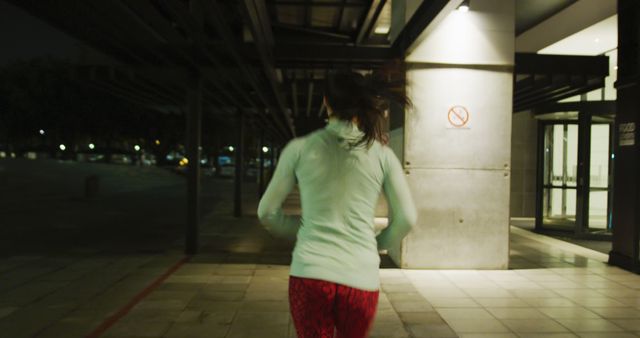 Woman Jogging at Night in Urban Area - Download Free Stock Images Pikwizard.com