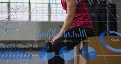 Woman sitting on plyometric box with fitness data visualization and analytics overlay