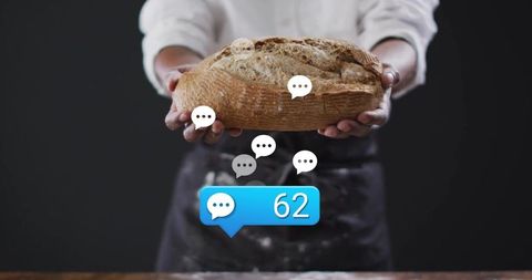 Artisan Baker Presenting Freshly Baked Bread with Interactive Elements