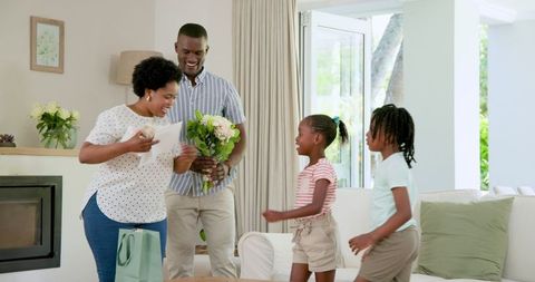 Joyful African American Family Sharing Together at Home