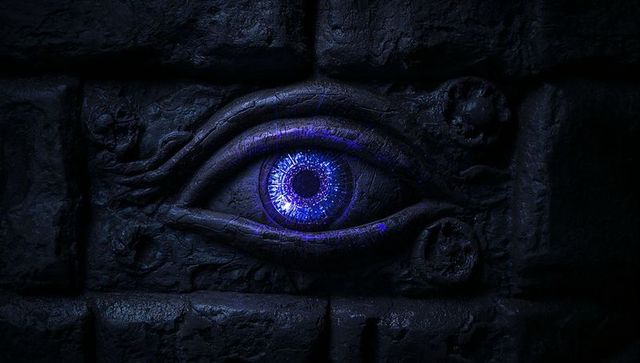 Mystic Blue-Purple Eye Carving in Ancient Temple Wall