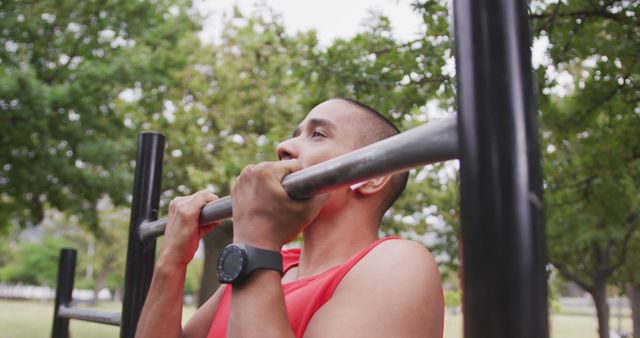 Young Man Exercising on Pull-Up Bar in Outdoor Park - Download Free Stock Images Pikwizard.com