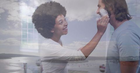 Happy Couple Playfully Engaging with Shaving Foam in Bathroom