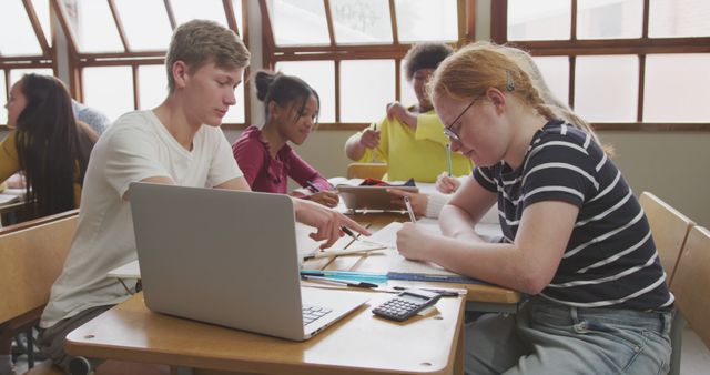 Teenagers Studying in Classroom Collaboratively Taking Notes and Sharing Ideas - Download Free Stock Images Pikwizard.com