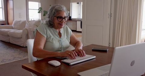 Senior Woman Enjoying Technology at Home on Laptop