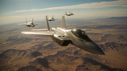 Four fighter jets flying in formation over airstrikes desert