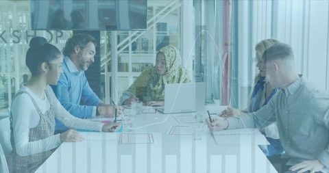 Team collaborating on financial strategy in modern office