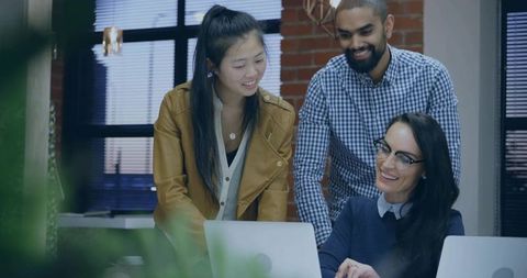 Multiracial Team Collaborating in Modern Office on Project