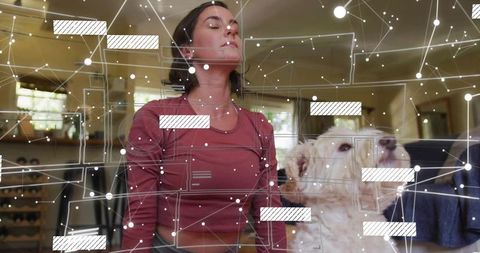 Woman meditating with dog visualized in networked home environment