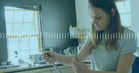 Home Chef Stirring Pot: Woman in Kitchen Preparing Meal