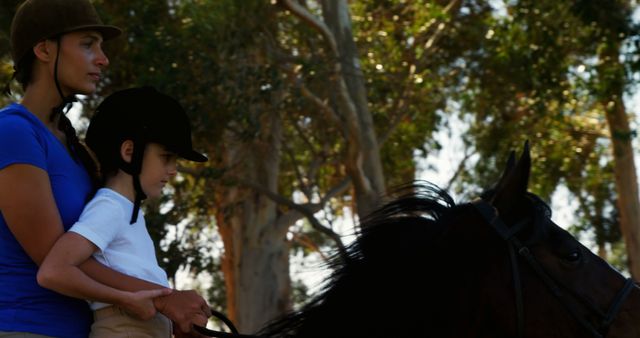 Female Horse Riding Instructor Training Young Boy in Outdoor Equestrian Scene - Download Free Stock Images Pikwizard.com