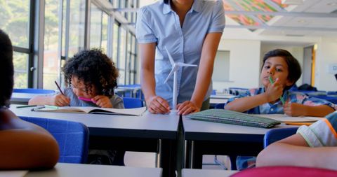Diverse Students Learning About Renewable Energy in Classroom