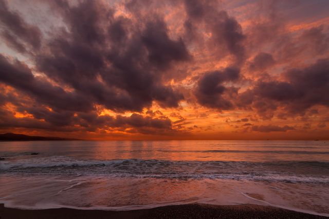Stunning Coastal Sunrise Over Calm Ocean with Dramatic Clouds - Download Free Stock Photos Pikwizard.com