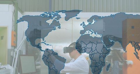 Researcher wearing vr headset testing prototype in laboratory with world map overlay
