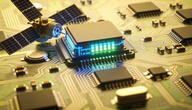 Microchip glowing teal led bar on printed circuit board with miniature satellite model