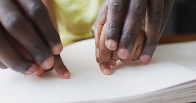 Parent and Child Reading Braille Together Close-up - Download Free Stock Images Pikwizard.com