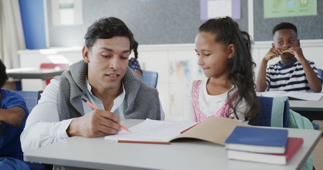 Man Teaching Girl in Classroom - Download Free Stock Images Pikwizard.com