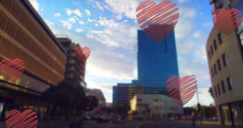 Falling Hearts Over Cityscape Symbolizing Love and Patriotism