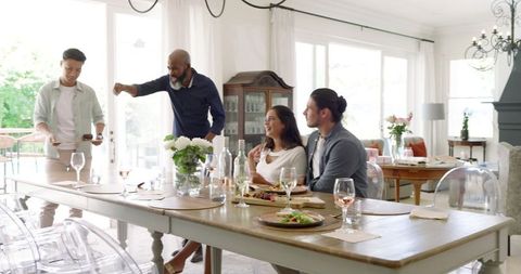 Diverse friends preparing for elegant celebration at home