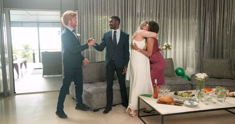 Diverse Friends Celebrating Joyful Intimate Living Room Wedding Reception