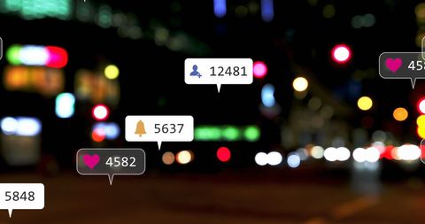 Social Media Interaction Icons Against Blurred City Lights