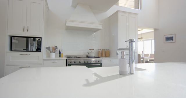 Modern White Kitchen with Stainless Steel Appliances and Minimalist Design - Download Free Stock Photos Pikwizard.com