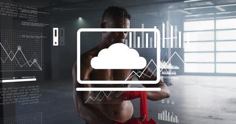 Muscular athlete wrapping red hand wraps in industrial gym displaying fitness analytics